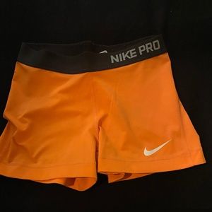 Neon orange Nike Pro 3” compression shorts